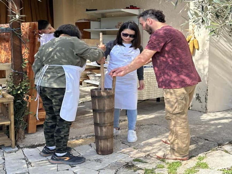 Cooking Class Lazarat - Stuffed petulla: a wooden rolling pin and a crisp golden finish