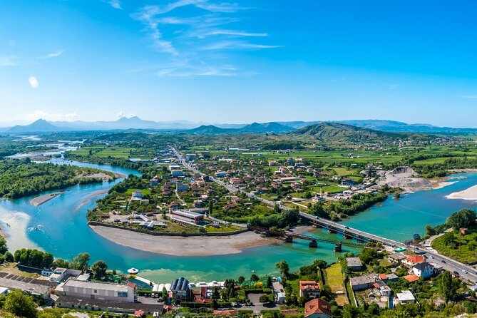 Full Day Shkodra Culture Tour from Tirana - Shkodra Lake in the afternoon: calm water, mountain views, and the Buna River delta option