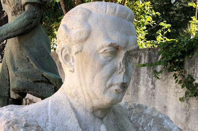 Guided Walking Tour: Dictator's Footprints Enver Hoxha in Tirana - The Unknown Partisan Monument, propaganda in stone