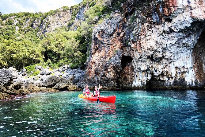 Kayak day in the coastline - Dhermi Beach: resort coastline, sea-level perspective