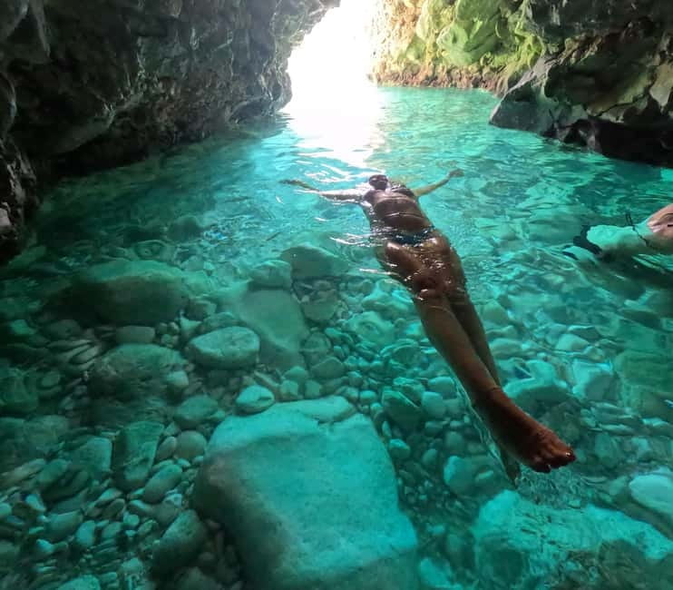 Secret Blue Cave & Grama Bay - Speed Boat Tour - Englishmen Bay: Swimming Under Big Cliffs