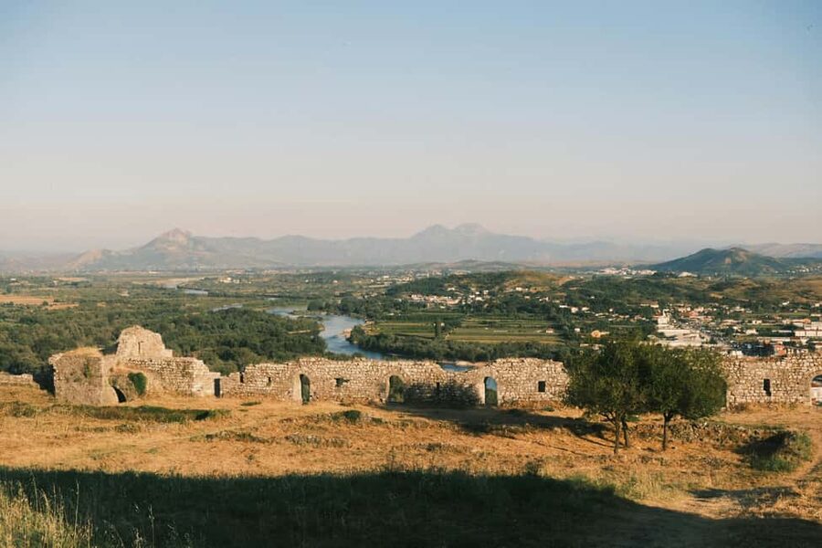 Shkoder Bike Tour: City Highlights - Shirokë Road lakeside ride: birds, mountains, and pier photos