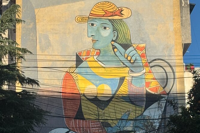 Tirana Mural Bike Tour: Street Art, Culture & Photography Stops - Lokomotiva: the former railway creative hub, plus the peace tank