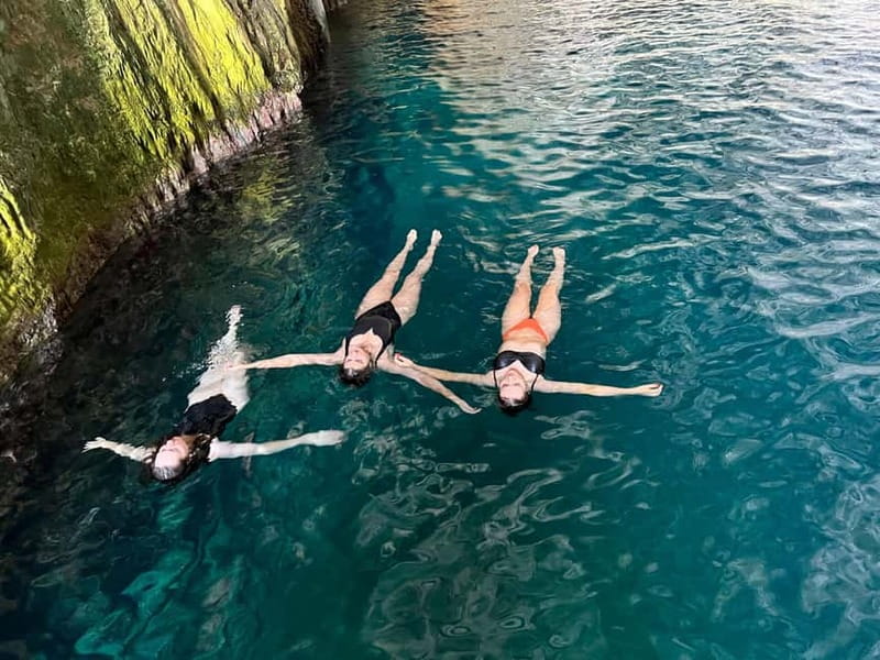 Vlora: Blue Cave and Grama Bay Full-Day Speedboat Tour - Dafina Bay and Dafina Cave: calm water with strange rock shapes