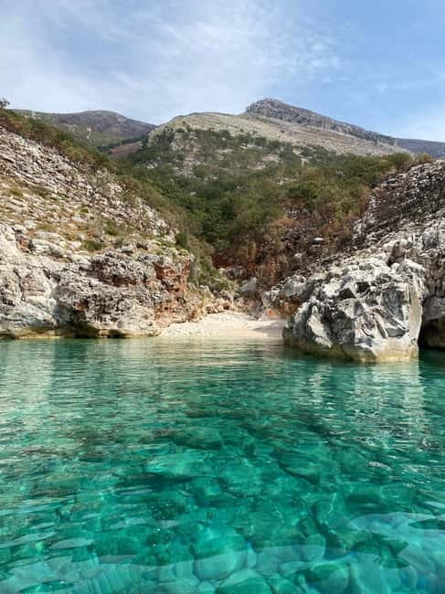 Vlore: Blue Cave & Smuggler<code>s Canyon, Karaburun Expedition – Key points before you go’ /></p>
<ul>
<li><strong>Multiple swim and snorkel windows</strong> in different coves, not just one or two short stops.</li>
<li><strong>A full circuit around Karaburun</strong> and nearby Sazan Island areas, including Blue Cave and San Andreas Beach.</li>
<li><strong>Guided touring where it matters</strong>, especially at the caves and the key canyon viewpoints.</li>
<li><strong>Speedboat-first logistics</strong>, with several transfer rides that keep the scenery changing constantly.</li>
<li><strong>Top-rated transport</strong>, with the boat ride experience getting very strong marks.</li>
<li><strong>Bring water shoes and a waterproof bag</strong> because you will be in and out of the water often.</li>
</ul>
<div class="twil" style="margin: 20px 0; padding: 15px 0;"><p>A few more Karaburun and Grama Bay trips:</p><ul style="margin: 10px 0; padding: 0; list-style: none;"><li style="margin: 0 0 10px 0; padding: 0 0 10px 0; border-bottom: 1px solid #eee; display: flex; align-items: flex-start; gap: 12px; line-height: 1.4;"><a href="https://lovingalbania.com/vlore-sazan-island-haxhi-ali-cave-and-karaburun-boat-tour/" aria-hidden="true" tabindex="-1"><img decoding="async" style="width: 80px; height: 60px; object-fit: cover; border-radius: 4px; flex-shrink: 0;" src="https://p1.lovingalbania.com/wp-content/uploads/vlore-sazan-island-haxhi-ali-cave-and-karaburun-boat-tour-150x150.jpg" alt="" loading="lazy"></a><div><a href="https://lovingalbania.com/vlore-sazan-island-haxhi-ali-cave-and-karaburun-boat-tour/">Vlorë: Sazan Island, Haxhi Ali Cave, and Karaburun Boat Tour</a><br><span style="font-size: 0.82em; color: #555; margin-top: 2px;"><span style="color: #A8322D;">★</span> 4.8 &middot; 2,170 reviews</span></div></li><li style="margin: 0 0 10px 0; padding: 0 0 10px 0; border-bottom: 1px solid #eee; display: flex; align-items: flex-start; gap: 12px; line-height: 1.4;"><a href="https://lovingalbania.com/vlore-sazan-island-haxhi-ali-cave-and-karaburun-boat-tour-2/" aria-hidden="true" tabindex="-1"><img decoding="async" style="width: 80px; height: 60px; object-fit: cover; border-radius: 4px; flex-shrink: 0;" src="https://p1.lovingalbania.com/wp-content/uploads/vlore-sazan-island-haxhi-ali-cave-and-karaburun-boat-tour-150x150.jpg" alt="" loading="lazy"></a><div><a href="https://lovingalbania.com/vlore-sazan-island-haxhi-ali-cave-and-karaburun-boat-tour-2/">Vlorë: Sazan Island, Haxhi Ali Cave, and Karaburun Boat Tour</a><br><span style="font-size: 0.82em; color: #555; margin-top: 2px;"><span style="color: #A8322D;">★</span> 4.9 &middot; 947 reviews</span></div></li><li style="margin: 0 0 10px 0; padding: 0 0 10px 0; border-bottom: 1px solid #eee; display: flex; align-items: flex-start; gap: 12px; line-height: 1.4;"><a href="https://lovingalbania.com/vlore-haxhi-ali-cave-karaburun-speedboat-tour-snorkeling/" aria-hidden="true" tabindex="-1"><img decoding="async" style="width: 80px; height: 60px; object-fit: cover; border-radius: 4px; flex-shrink: 0;" src="https://p1.lovingalbania.com/wp-content/uploads/vlore-haxhi-ali-cave-karaburun-speedboat-tour-snorkeling-150x150.jpg" alt="" loading="lazy"></a><div><a href="https://lovingalbania.com/vlore-haxhi-ali-cave-karaburun-speedboat-tour-snorkeling/">Vlore: Haxhi Ali Cave, Karaburun Speedboat Tour & Snorkeling</a><br><span style="font-size: 0.82em; color: #555; margin-top: 2px;"><span style="color: #A8322D;">★</span> 4.9 &middot; 867 reviews</span></div></li><li style="margin: 0 0 10px 0; padding: 0 0 10px 0; border-bottom: 1px solid #eee; display: flex; align-items: flex-start; gap: 12px; line-height: 1.4;"><a href="https://lovingalbania.com/from-vlore-haxhi-ali-cave-karaburun-beach-speedboat-tour/" aria-hidden="true" tabindex="-1"><img decoding="async" style="width: 80px; height: 60px; object-fit: cover; border-radius: 4px; flex-shrink: 0;" src="https://p1.lovingalbania.com/wp-content/uploads/from-vlore-haxhi-ali-cave-karaburun-beach-speedboat-tour-150x150.jpg" alt="" loading="lazy"></a><div><a href="https://lovingalbania.com/from-vlore-haxhi-ali-cave-karaburun-beach-speedboat-tour/">From Vlore: Haxhi Ali Cave & Karaburun Beach Speedboat Tour</a><br><span style="font-size: 0.82em; color: #555; margin-top: 2px;"><span style="color: #A8322D;">★</span> 4.9 &middot; 791 reviews</span></div></li><li style="margin: 0; padding: 0; border-bottom: none; display: flex; align-items: flex-start; gap: 12px; line-height: 1.4;"><a href="https://lovingalbania.com/from-vlore-blue-cave-and-grama-bay-adventures/" aria-hidden="true" tabindex="-1"><img decoding="async" style="width: 80px; height: 60px; object-fit: cover; border-radius: 4px; flex-shrink: 0;" src="https://p1.lovingalbania.com/wp-content/uploads/from-vlore-blue-cave-and-grama-bay-adventures-150x150.jpg" alt="" loading="lazy"></a><div><a href="https://lovingalbania.com/from-vlore-blue-cave-and-grama-bay-adventures/">From Vlore: Blue Cave and Grama Bay Adventures</a><br><span style="font-size: 0.82em; color: #555; margin-top: 2px;"><span style="color: #A8322D;">★</span> 5.0 &middot; 583 reviews</span></div></li></ul></div><h2 id="the-karaburun-speedboat-rhythm-8-hours-that-actually-move">The Karaburun speedboat rhythm: 8 hours that actually move</h2>
<p><img width="800" height="450" decoding="async" src=